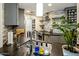 Modern kitchen with stainless steel appliances, grey cabinets, and stylish backsplash at 5104 N 32Nd St # 105, Phoenix, AZ 85018