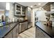 Modern kitchen with stainless steel appliances, grey cabinets, and stylish countertops at 5104 N 32Nd St # 105, Phoenix, AZ 85018