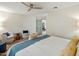Bright main bedroom boasts light hardwood floors, a ceiling fan, and stylish, comfortable furniture at 5104 N 32Nd St # 105, Phoenix, AZ 85018