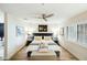 Beautiful bedroom featuring a large bed, modern lighting, and a ceiling fan at 5104 N 32Nd St # 105, Phoenix, AZ 85018