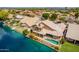 Waterfront property with private pool, covered patio, boat dock and lush landscaping at 518 S Bay Shore Blvd, Gilbert, AZ 85233