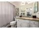 This bathroom is complete with a shower/tub combo and granite countertops at 518 S Bay Shore Blvd, Gilbert, AZ 85233