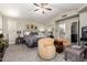 This bedroom features neutral colors, a ceiling fan, and access to the ensuite bathroom at 518 S Bay Shore Blvd, Gilbert, AZ 85233