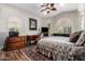 Bedroom with a ceiling fan, a patterned rug, and large windows allowing lots of natural light at 518 S Bay Shore Blvd, Gilbert, AZ 85233