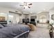 The bedroom features a ceiling fan, sitting area, and window seat with plush cushions at 518 S Bay Shore Blvd, Gilbert, AZ 85233