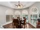 Cozy breakfast nook with a round table, chairs, and large windows offering serene water views at 518 S Bay Shore Blvd, Gilbert, AZ 85233