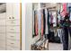 Custom walk-in closet with built-in shelves, hanging rods, and drawers at 518 S Bay Shore Blvd, Gilbert, AZ 85233