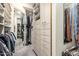 Walk-in closet with custom organizers, drawers, and cabinets at 518 S Bay Shore Blvd, Gilbert, AZ 85233