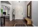 Elegant foyer featuring a decorative mirror, neutral tones, and a glimpse of a cozy bedroom at 518 S Bay Shore Blvd, Gilbert, AZ 85233