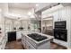 Bright kitchen features a large island, modern appliances, and a view to a dinette and backyard at 518 S Bay Shore Blvd, Gilbert, AZ 85233
