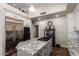 Well-appointed kitchen featuring a large island with cooktop, stainless steel appliances, and ample counter space at 518 S Bay Shore Blvd, Gilbert, AZ 85233