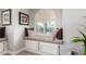 This window seat is complete with plush pillows and an arching window that allows lots of light at 518 S Bay Shore Blvd, Gilbert, AZ 85233