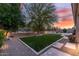 Spacious backyard featuring a manicured lawn, desert landscaping, a fenced-in pool, and desert landscaping at 5813 E Ashler Hills Dr, Cave Creek, AZ 85331