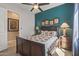 Inviting bedroom with a ceiling fan, decorative lamps, and a colorful quilt on the bed at 5813 E Ashler Hills Dr, Cave Creek, AZ 85331