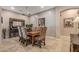 Elegant dining room with wooden table, upholstered chairs, and chandelier at 5813 E Ashler Hills Dr, Cave Creek, AZ 85331