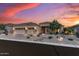 Beautiful single-story home featuring a well-manicured front yard, a three car garage, and stone accents at 5813 E Ashler Hills Dr, Cave Creek, AZ 85331