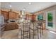 This kitchen features a center island with barstool seating, stainless steel appliances, and granite countertops at 5813 E Ashler Hills Dr, Cave Creek, AZ 85331