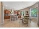 This kitchen offers a spacious design with a center island and barstool seating, custom cabinets, and a breakfast nook at 5813 E Ashler Hills Dr, Cave Creek, AZ 85331