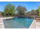 Sparkling pool featuring a waterfall feature, surrounded by well-manicured landscaping at 5813 E Ashler Hills Dr, Cave Creek, AZ 85331