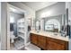 Updated bathroom featuring a double sink vanity, large mirrors, and a shower-tub combination at 6335 E Brown Rd # 1084, Mesa, AZ 85205
