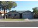Charming single-story home with well-manicured lawn, inviting curb appeal, and mature trees at 6335 E Brown Rd # 1084, Mesa, AZ 85205
