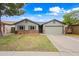 Charming single-story home with a well-maintained lawn, two-car garage, and inviting curb appeal at 6335 E Brown Rd # 1084, Mesa, AZ 85205