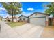 Street view of a well-kept single-Gathering home, including a two-car garage and a tree-lined street at 6335 E Brown Rd # 1084, Mesa, AZ 85205