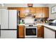 Bright kitchen featuring wood cabinets, stainless appliances, and ample counter space at 6335 E Brown Rd # 1084, Mesa, AZ 85205