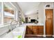 Spacious kitchen sink offering views into the open-concept living area at 6335 E Brown Rd # 1084, Mesa, AZ 85205