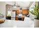Bright kitchen with white countertops, dark cabinets, vaulted ceilings, and stainless steel appliances at 6335 E Brown Rd # 1084, Mesa, AZ 85205