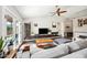 Bright living room featuring large windows, contemporary furnishings, and a vaulted ceiling at 6335 E Brown Rd # 1084, Mesa, AZ 85205