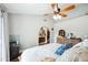 Bright main bedroom featuring a ceiling fan, ensuite bathroom, walk-in closet, and neutral walls at 6335 E Brown Rd # 1084, Mesa, AZ 85205