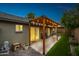 Covered backyard patio with a pergola featuring string lights, paver patio and seating area at 6335 E Brown Rd # 1084, Mesa, AZ 85205