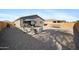 Spacious backyard with low-maintenance gravel, perfect for outdoor entertaining and recreation at 697 E Ruby Dr, Casa Grande, AZ 85122