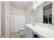 Bright bathroom with a white vanity, mirror, and shower with a white shower curtain at 697 E Ruby Dr, Casa Grande, AZ 85122