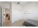 Comfortable bedroom with closet, plush carpet, light walls, and a sunny window at 697 E Ruby Dr, Casa Grande, AZ 85122