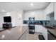 Modern kitchen with white cabinets, stainless steel appliances, and granite countertops at 697 E Ruby Dr, Casa Grande, AZ 85122