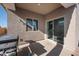 Covered patio with a BBQ grill and slider window at 697 E Ruby Dr, Casa Grande, AZ 85122