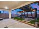 Inviting backyard featuring a pergola-covered patio, hot tub, manicured lawn, and ample space for outdoor relaxation and entertaining at 6983 W Andrea Dr, Peoria, AZ 85383