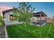 Inviting backyard features a pergola-covered patio with lights, hot tub, and comfortable seating for outdoor enjoyment and entertaining at 6983 W Andrea Dr, Peoria, AZ 85383