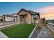 Attractive home with desert landscaping, an inviting front porch, and a well-maintained yard at 6983 W Andrea Dr, Peoria, AZ 85383