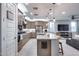 Modern kitchen featuring a large island, stainless appliances, and stylish pendant lighting at 6983 W Andrea Dr, Peoria, AZ 85383
