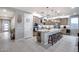 Gourmet kitchen with granite island, stainless appliances, pendant lights, and ample cabinet space at 6983 W Andrea Dr, Peoria, AZ 85383