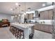 Spacious kitchen with granite island, stainless appliances, pendant lighting, and open layout at 6983 W Andrea Dr, Peoria, AZ 85383