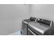 Efficient laundry room featuring modern, front-loading washer and dryer appliances at 6983 W Andrea Dr, Peoria, AZ 85383