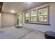 Covered patio with a view into the home showcases a seamless blend of indoor/outdoor living and entertainment space at 6983 W Andrea Dr, Peoria, AZ 85383