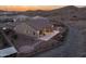 Aerial view of a single Gathering home with a patio and well manicured yard and desert views at 7659 S 164Th Ln, Goodyear, AZ 85338