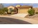 Charming single-story home with a two-car garage and desert landscaping at 7659 S 164Th Ln, Goodyear, AZ 85338