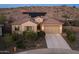 Charming single-Gathering home featuring a two-car garage and solar panels on the roof at 7659 S 164Th Ln, Goodyear, AZ 85338