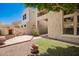 Backyard featuring a brick fireplace, mature trees, and low maintenance landscaping at 8149 N 13Th Pl, Phoenix, AZ 85020